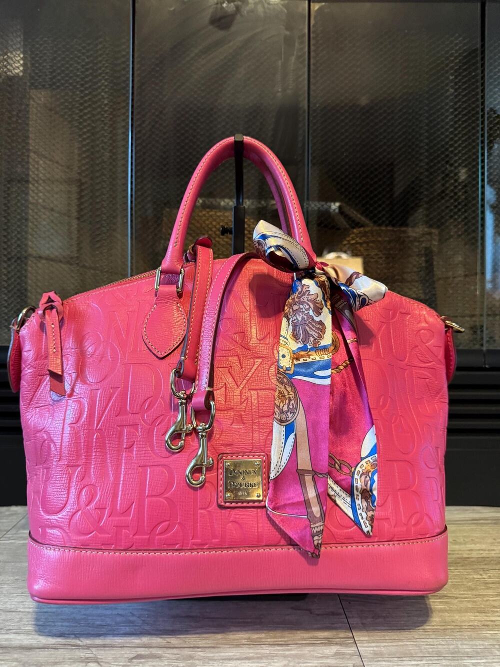 Signature hot pink Graffiti Dooney and Bourke Lucca handled satchel with strap